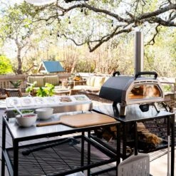 Ooni Karu 16 Inch Portable Wood And Charcoal Fired Outdoor Pizza Oven -Joes BBQs Store Ooni Karu 16 in use b 1024x1024 2x b9029692 dd0e 422c b047 d477198dba2f