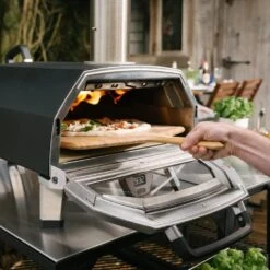 Ooni Karu 16 Inch Portable Wood And Charcoal Fired Outdoor Pizza Oven Startup Bundle -Joes BBQs Store Ooni Karu 16 in use h 1024x1024 2x 43451868 9305 4102 85fa f8247189d158