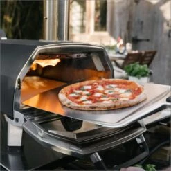Ooni Karu 16 Inch Portable Wood And Charcoal Fired Outdoor Pizza Oven Loaded Bundle -Joes BBQs Store Ooni Karu 16 in use k 1024x1024 2x ae5cbb03 80cf 4b21 9556 c3786d37201c 1