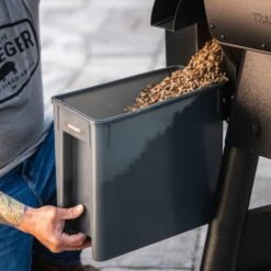 Traeger Staydry Pellet Bin And Lid - BAC615 16 Traeger Staydry Pellet Bin And Lid - BAC615 -Joes BBQs Store traeger staydry pellet bin lifestyle pouring 1 1